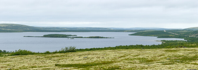 Panoramic view of the lake in the tundra of the Kola Peninsula. The Arctic, Russia.