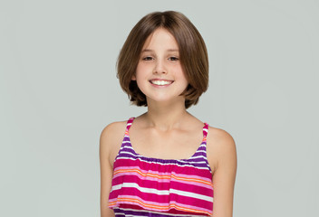 Young girl posing in fashionable dress.