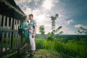 Happy couple traveling at Bali, rice terraces of Jatiluwih, Ubud
