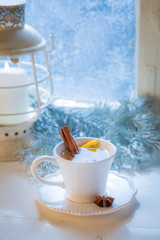 Sweet and hot tea with orange and cinnamon for Christmas