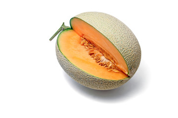 Orange Melon fruit cut to show flesh and seeds on white background.