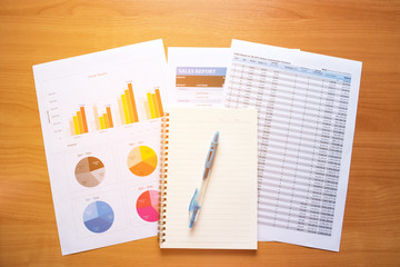 Business stuff with Graph chart and note