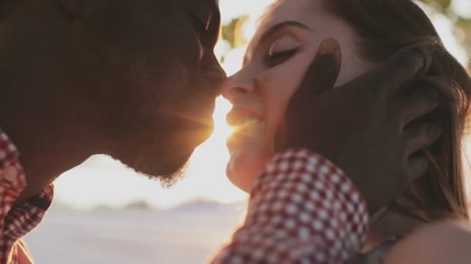 0:12 Couple kissing on sunset background Search photos interethnic