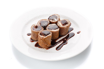 Fresh sweet chocolate pancakes with cheese and sauce