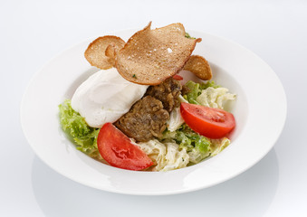 Restaurant food. Salad with bread in a plate. Delicious food.
