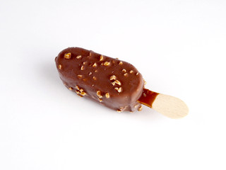 Ice cream covered with chocolate and almonds on white background