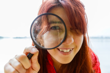 Portrait of woman with magnifier