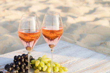 Refreshing  Rosa Wine in a Glass . Beach Cheers Celebration Friendship Summer Fun Dinner Concept.