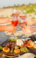 Refreshing  Rosa Wine in a Glass . Beach Cheers Celebration Friendship Summer Fun Dinner Concept.