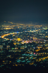 Night city scape at top view point of Chiang Mai, Thailand.