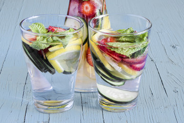 Dietary detox drink with lemon juice, strawberries and cucumber.