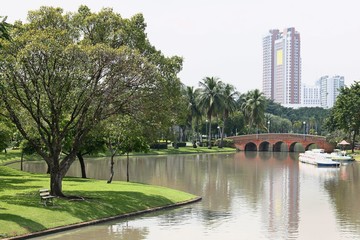 Arch brick bridge over the lake at Jatujak(Chatuchak) public city park