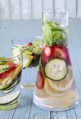 Dietary detox drink with lemon juice, strawberries and cucumber.