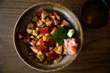 Sushi don , raw sushi salmon tuna octopus and egg on rice , Japanese food