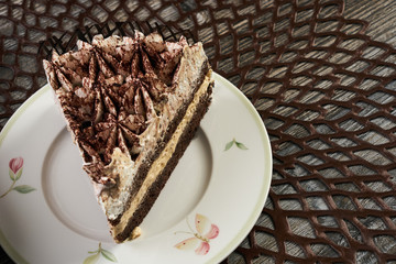 Cup of tea and Delicious chocolate cake with whipped cream