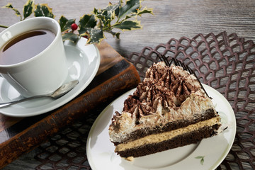 Cup of tea and Delicious chocolate cake with whipped cream