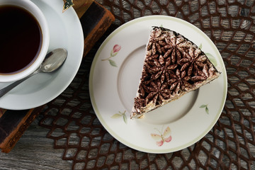 Cup of tea and Delicious chocolate cake with whipped cream