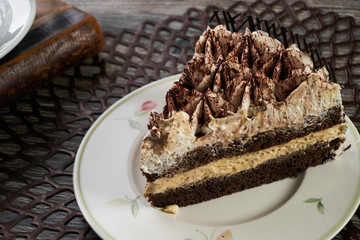 Cup of tea and Delicious chocolate cake with whipped cream