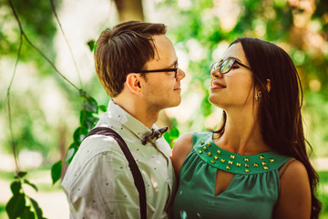 Fototapeta premium Beautiful young couple on the park background
