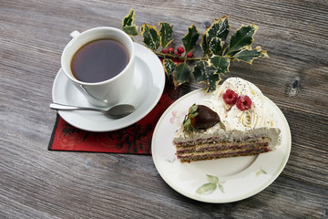 Sliced white Christmas cake with whipped cream