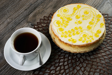 Lemon cheesecake with a cup of tea