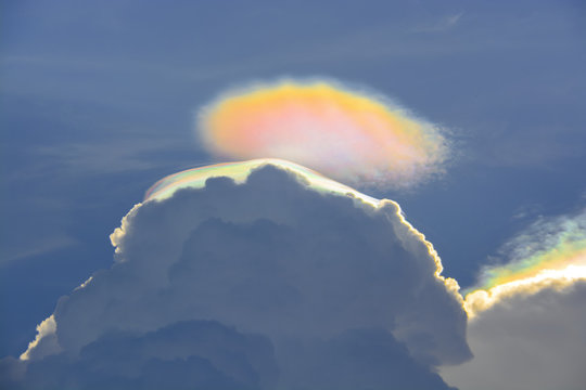 Iridescent pileus cloud, rainbow clouds background