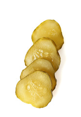 Slices of pickled cucumber isolated on white