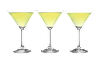 Glasses of lemon drop martini on white background