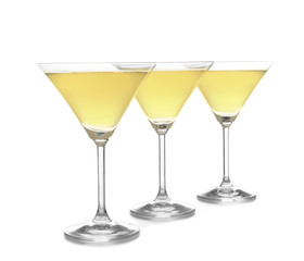 Glasses of lemon drop martini on white background