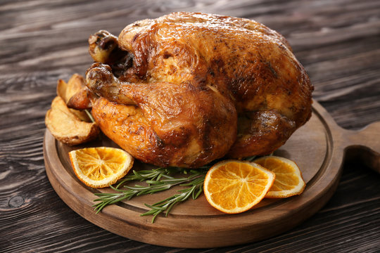 Roasted turkey on wooden board