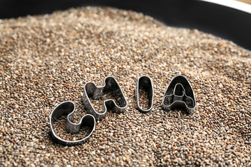 Letters on chia seeds, closeup