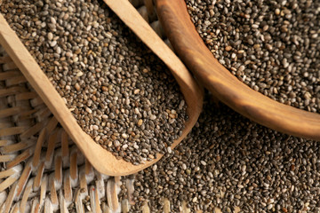 Bowl and scoop with chia seeds, closeup
