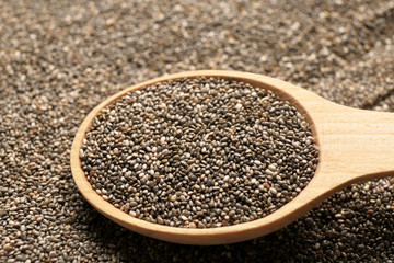 Wooden spoon on chia seeds, closeup