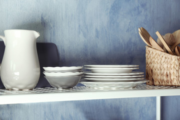 Tableware on shelf indoors