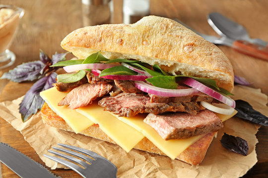 Steak sandwich on kitchen table