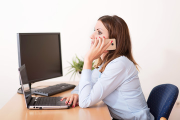 Business woman use her phone in the office