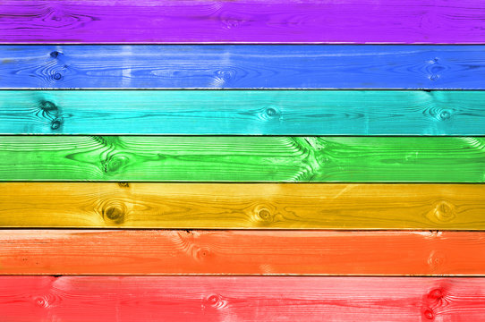 Colorful rainbow painted wood planks background, gay LGBTQ flag, LGBT pride month concept