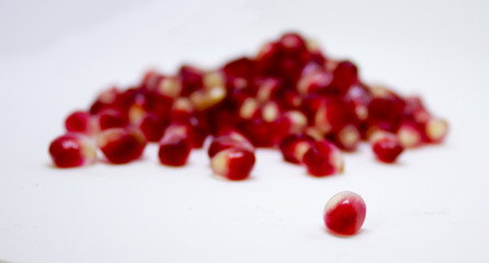 pomegranate seeds on a white background