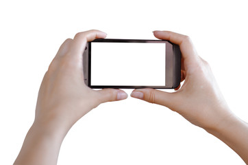 Female hands holding a phone isolated on white.