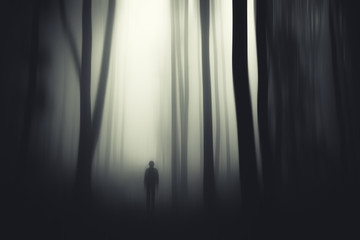 dark fantasy forest with mysterious man silhouette at night