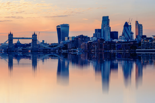 Cityscape of London at sunset with reflection from river Thames - Powered by Adobe