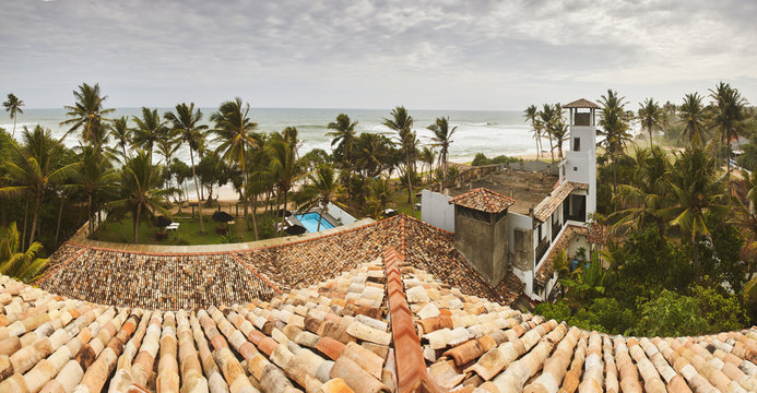 Panoramic top view to the ocean coast through hotel roof top