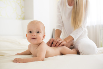 Portrait of happy mother with infant son