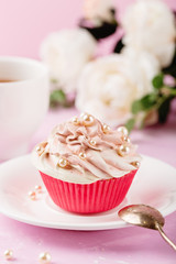 Pink cupcake decorated with pearl beads