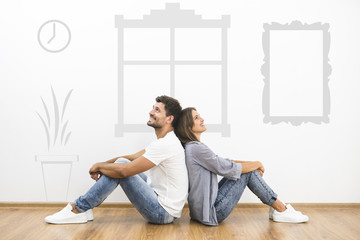 The happy couple dream near the wall with a symbols