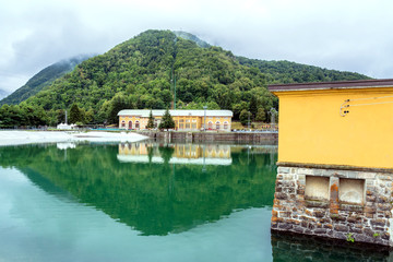 Naklejka premium landscape with hydroelectric power plant and lake in Ligonchio, Italy