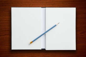 open notebook with pencil