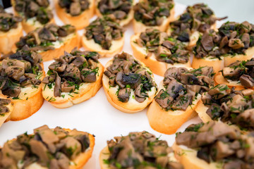 Close up bruschetta with fried mushrooms