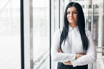 Fototapeta premium Successful confident business woman in an office setting