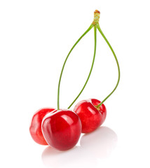 Red cherries on a white isolated background.